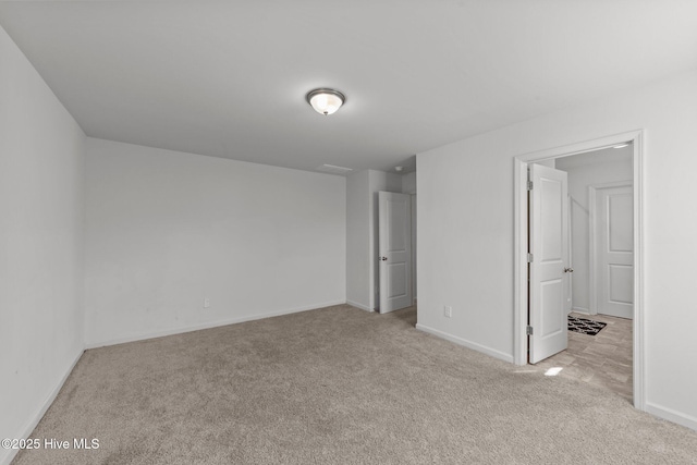 unfurnished bedroom with light colored carpet