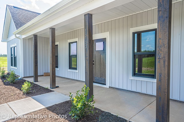 property entrance with covered porch