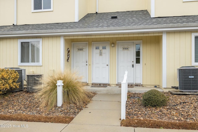 doorway to property with central air condition unit