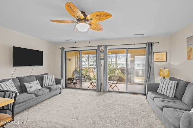 living room with carpet floors and ceiling fan