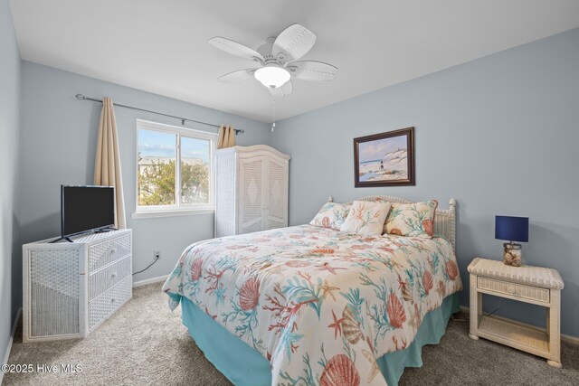 bedroom featuring ceiling fan and carpet