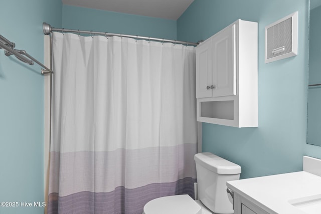 bathroom with vanity, toilet, and a shower with shower curtain