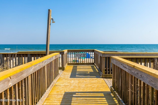 surrounding community featuring a water view