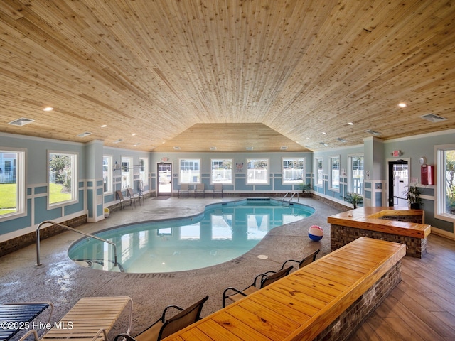 view of swimming pool with a hot tub