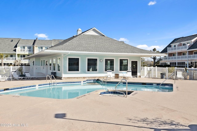 view of pool featuring a hot tub and a patio area