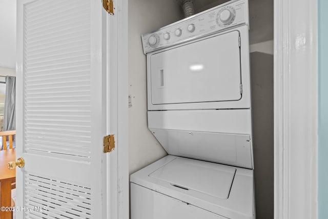 laundry area featuring stacked washer and clothes dryer