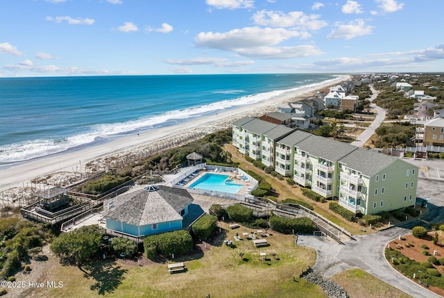 aerial view featuring a view of the beach and a water view