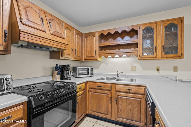 kitchen featuring light tile patterned flooring, sink, and electric range