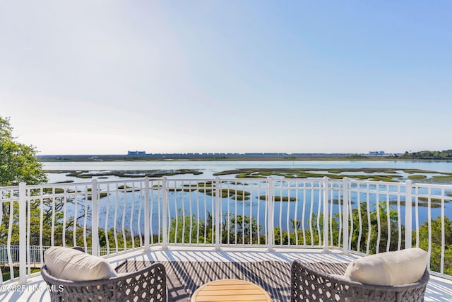balcony featuring a water view