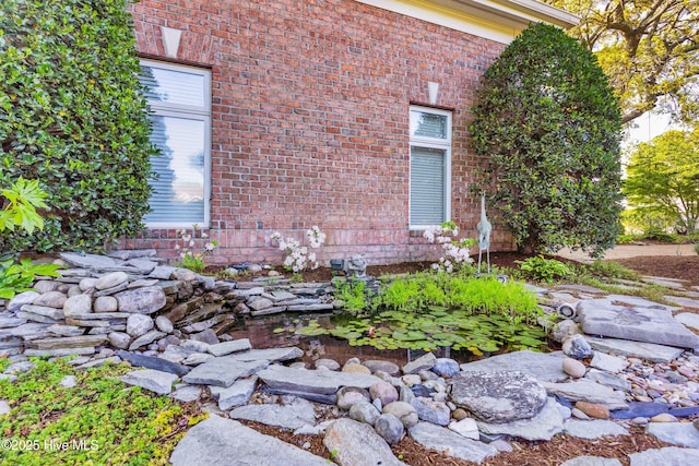 view of home's exterior with brick siding