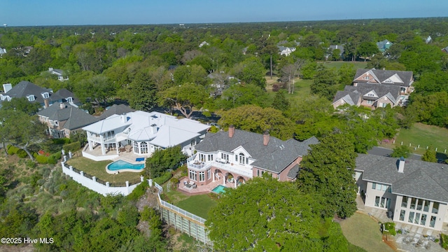 bird's eye view with a forest view and a residential view