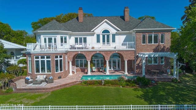 rear view of property featuring a balcony, an outdoor hangout area, french doors, and a patio