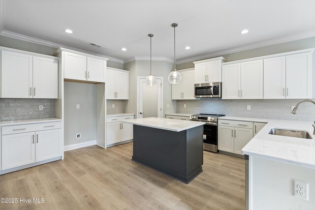 unfurnished living room with baseboards, stairway, ornamental molding, light wood-type flooring, and recessed lighting