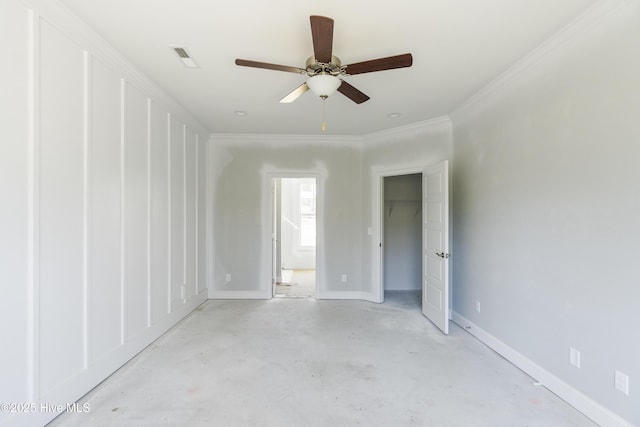 empty room with crown molding and ceiling fan