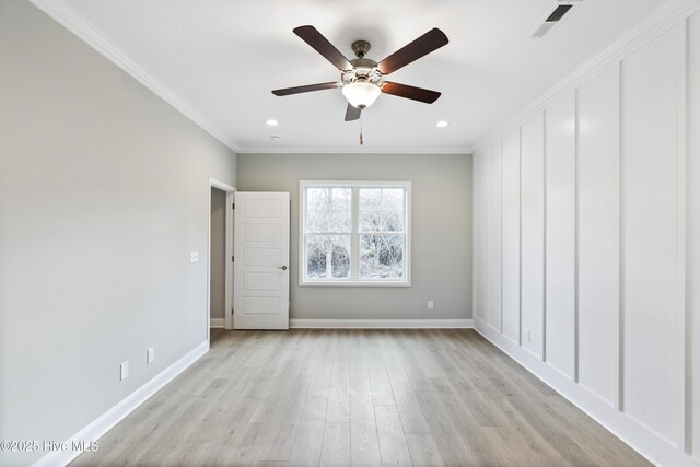 kitchen with stainless steel appliances, a sink, white cabinets, a center island, and pendant lighting