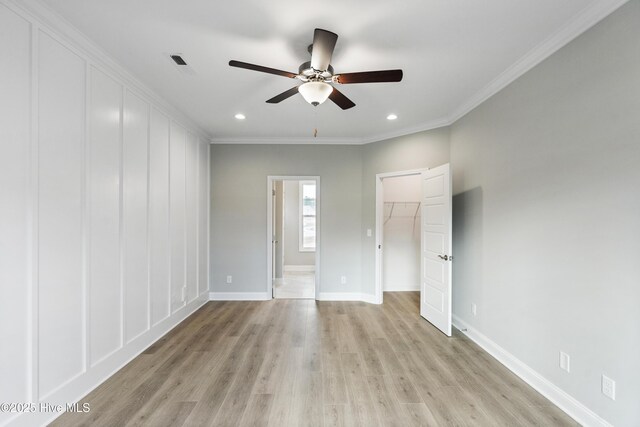 kitchen with appliances with stainless steel finishes, a center island, and light countertops