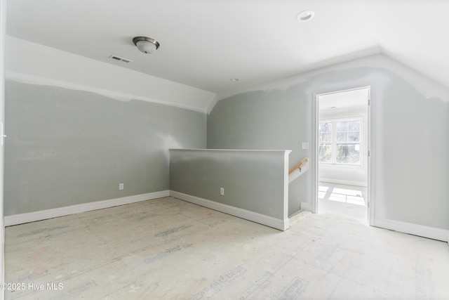 additional living space featuring vaulted ceiling