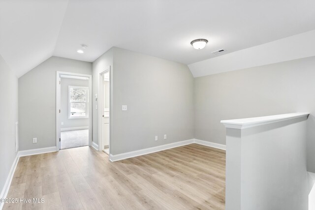 kitchen with light countertops, white cabinetry, a sink, and decorative light fixtures