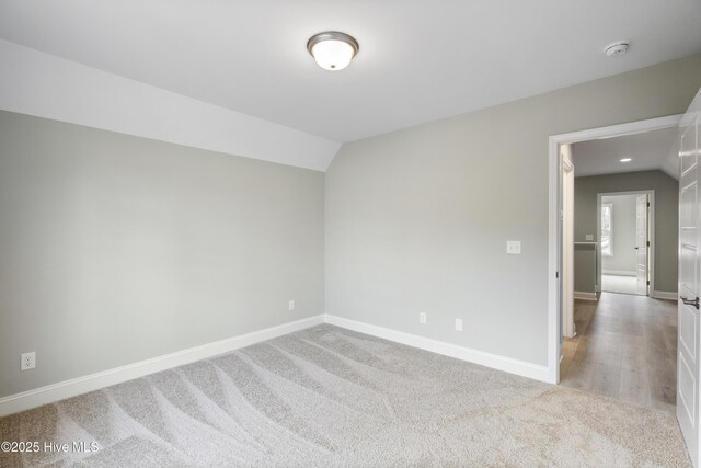 unfurnished room with light wood-type flooring, baseboards, crown molding, and recessed lighting