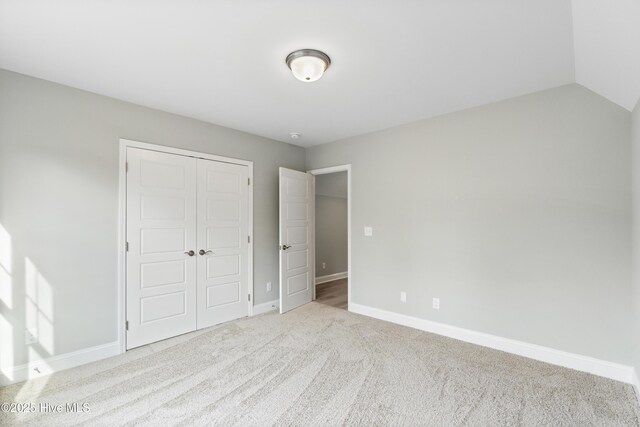 bathroom featuring baseboards, visible vents, toilet, wood finished floors, and vanity