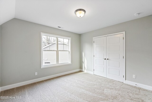 full bath featuring shower / bath combination, visible vents, toilet, lofted ceiling, and vanity