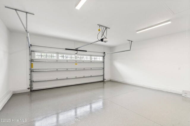 unfurnished bedroom featuring baseboards, a closet, vaulted ceiling, and light colored carpet