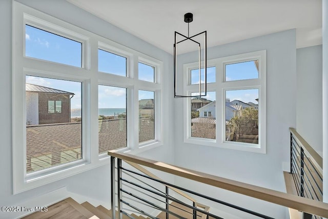 staircase with wood finished floors