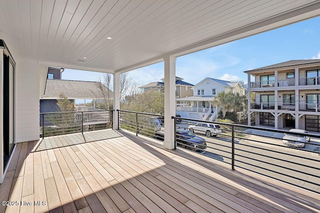 wooden terrace featuring a residential view