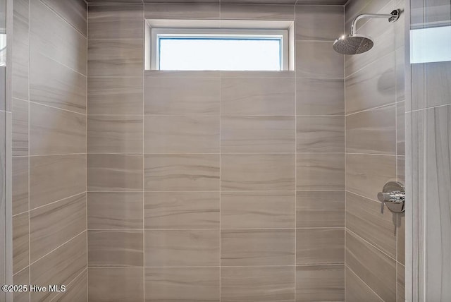 bathroom with tiled shower