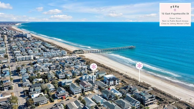 bird's eye view featuring a view of the beach and a water view