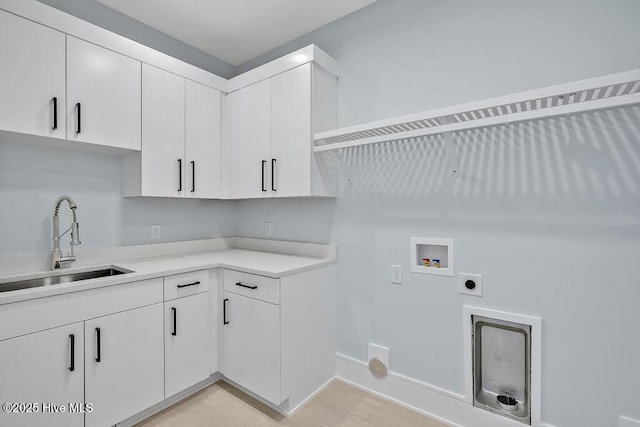 clothes washing area with light tile patterned floors, hookup for an electric dryer, a sink, hookup for a washing machine, and cabinet space