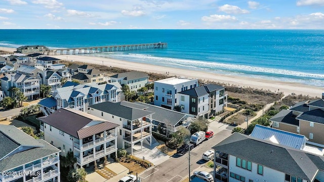 birds eye view of property featuring a view of the beach and a water view