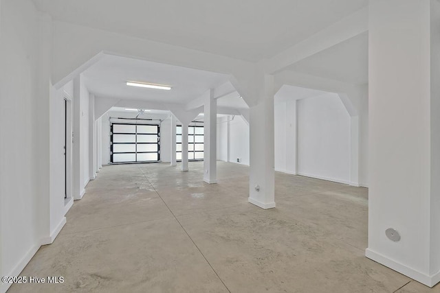 interior space featuring baseboards