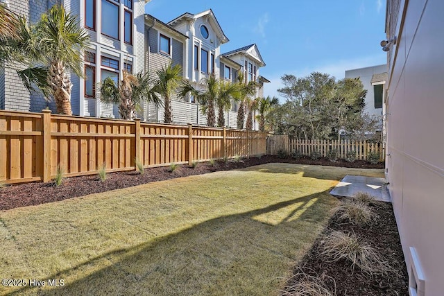 view of yard with a fenced backyard