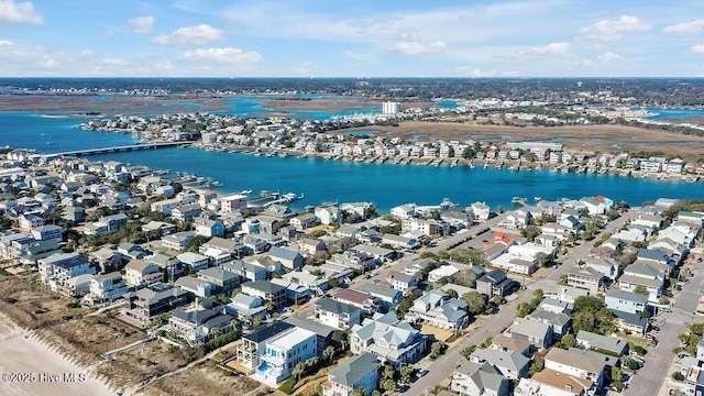 drone / aerial view featuring a residential view and a water view