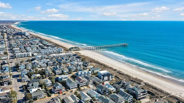 birds eye view of property featuring a view of the beach and a water view