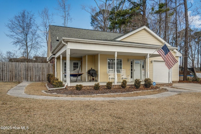 view of front facade with a garage and a porch