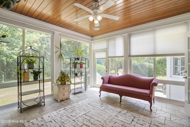 sunroom with wooden ceiling and ceiling fan