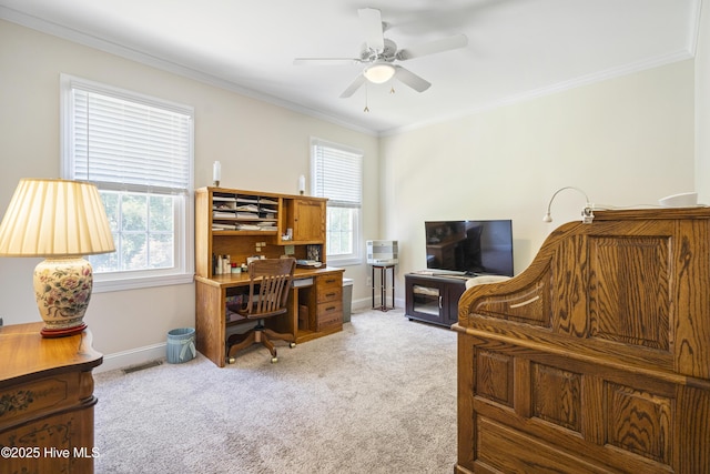 home office featuring crown molding, light colored carpet, a healthy amount of sunlight, and ceiling fan