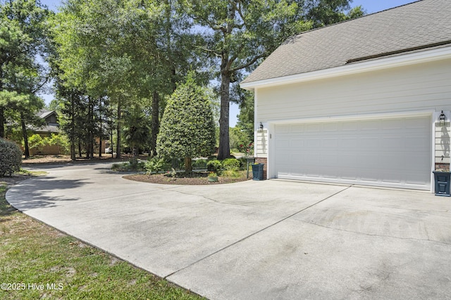 view of side of home with a garage