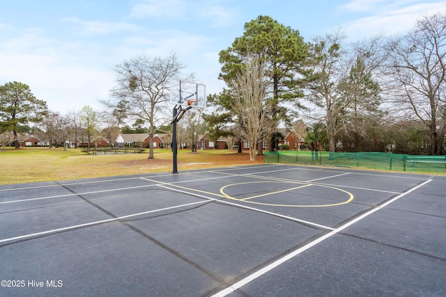 view of basketball court featuring a lawn