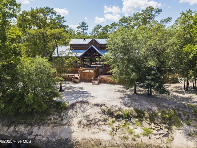 view of front of home featuring a wooden deck and a gazebo