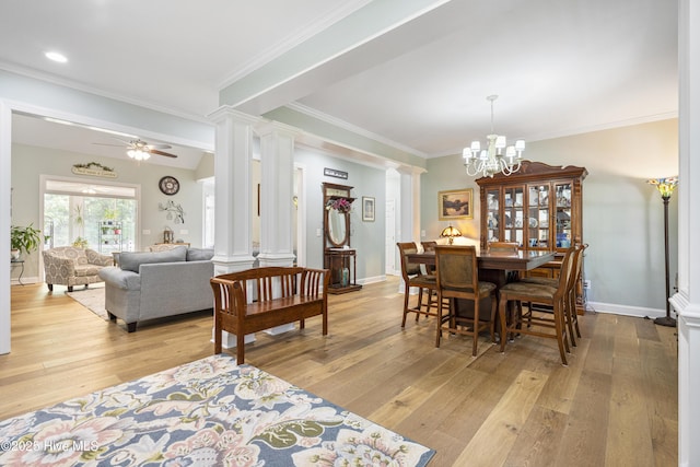 dining area with crown molding, light hardwood / wood-style flooring, and decorative columns