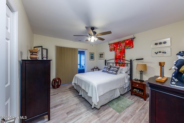 bedroom featuring ceiling fan and light hardwood / wood-style flooring