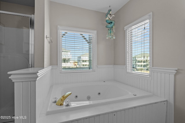 bathroom with shower with separate bathtub