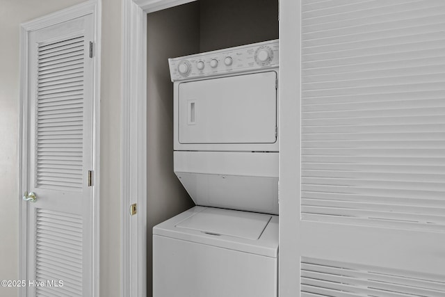 laundry area featuring stacked washer and dryer