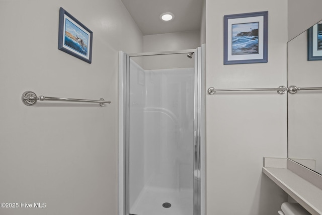 bathroom featuring an enclosed shower