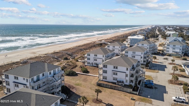 aerial view featuring a view of the beach and a water view