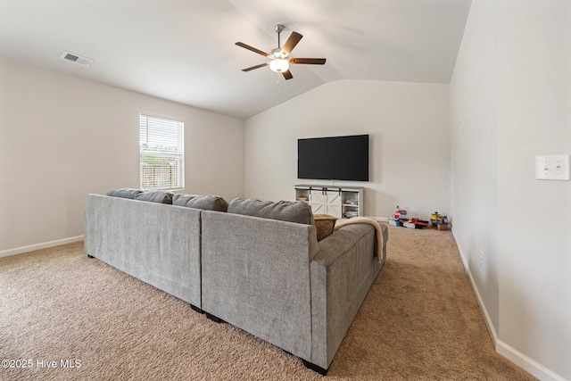 carpeted living room featuring ceiling fan and vaulted ceiling