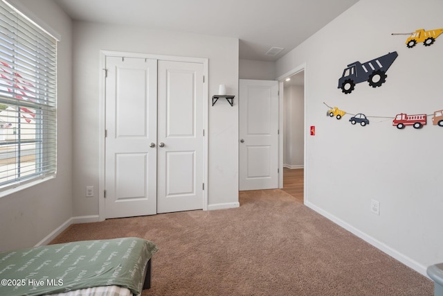 unfurnished bedroom with carpet and a closet